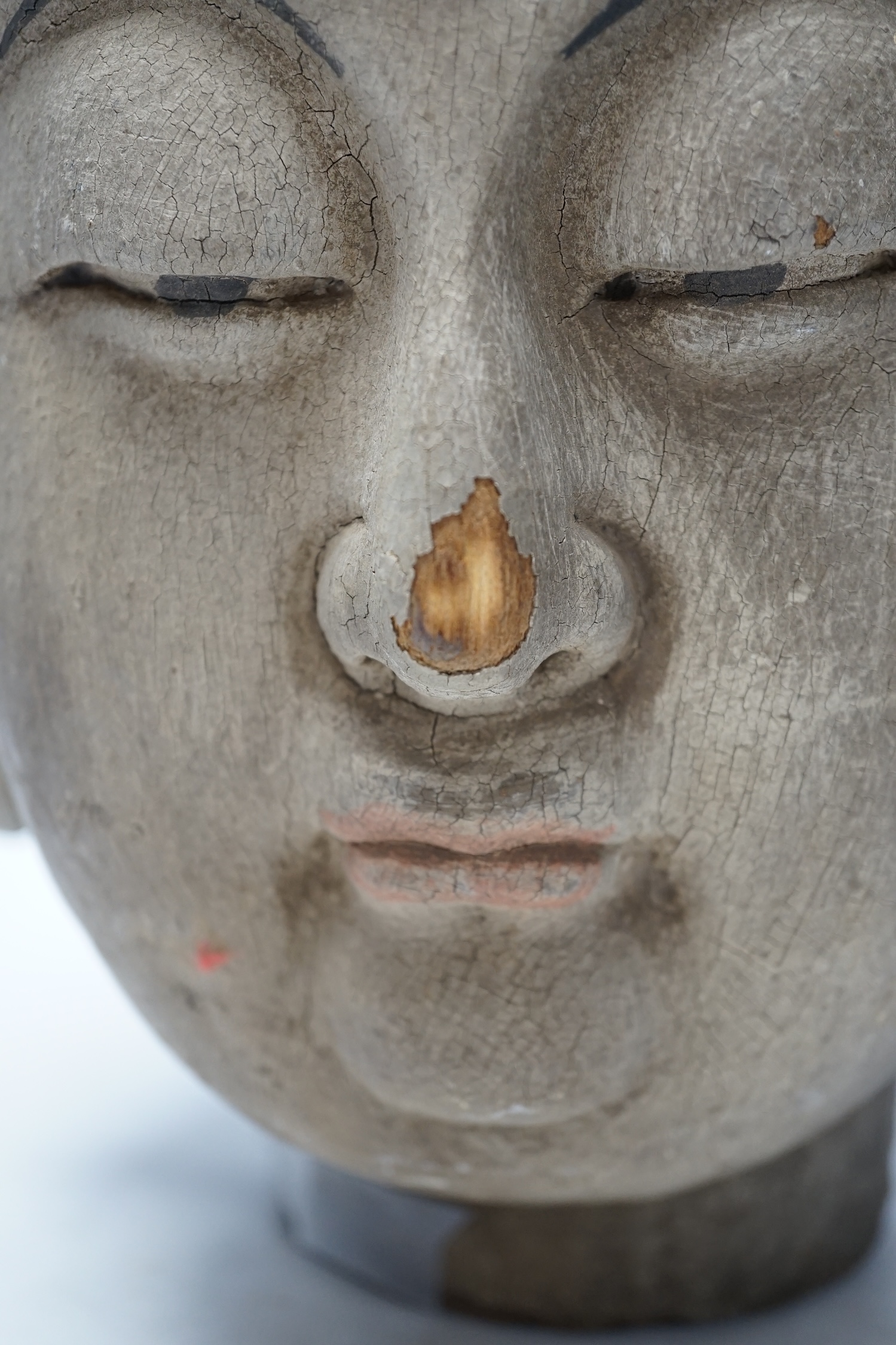 A Chinese painted wood head of Guanyin, Yuan style, 40cm